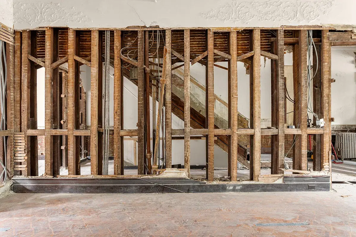 Interior framing exposed during renovation at 128 West 121st Street