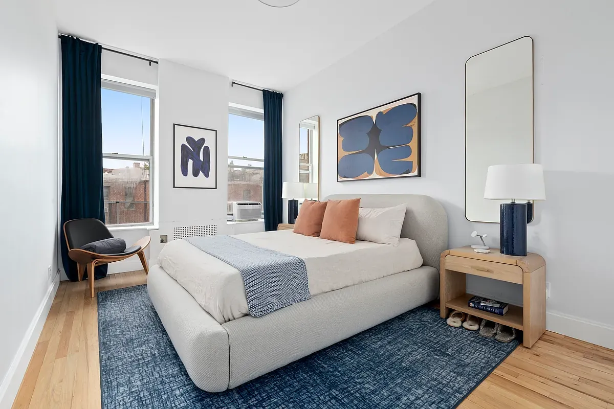Bedroom with two windows at 14 West 121st Street