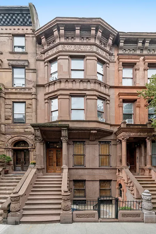 Brownstone facade and stoop at 14 West 121st Street in Harlem