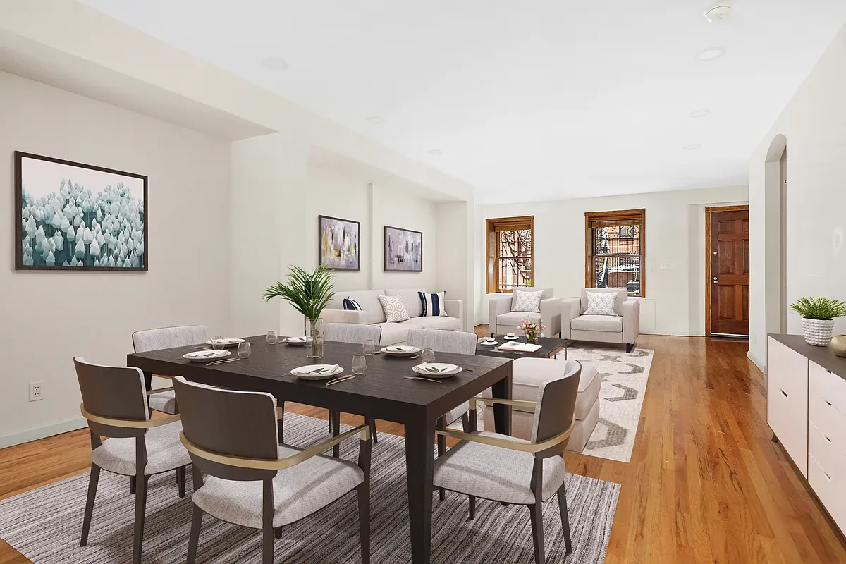 Virtually staged open dining and living room at 14 West 121st Street