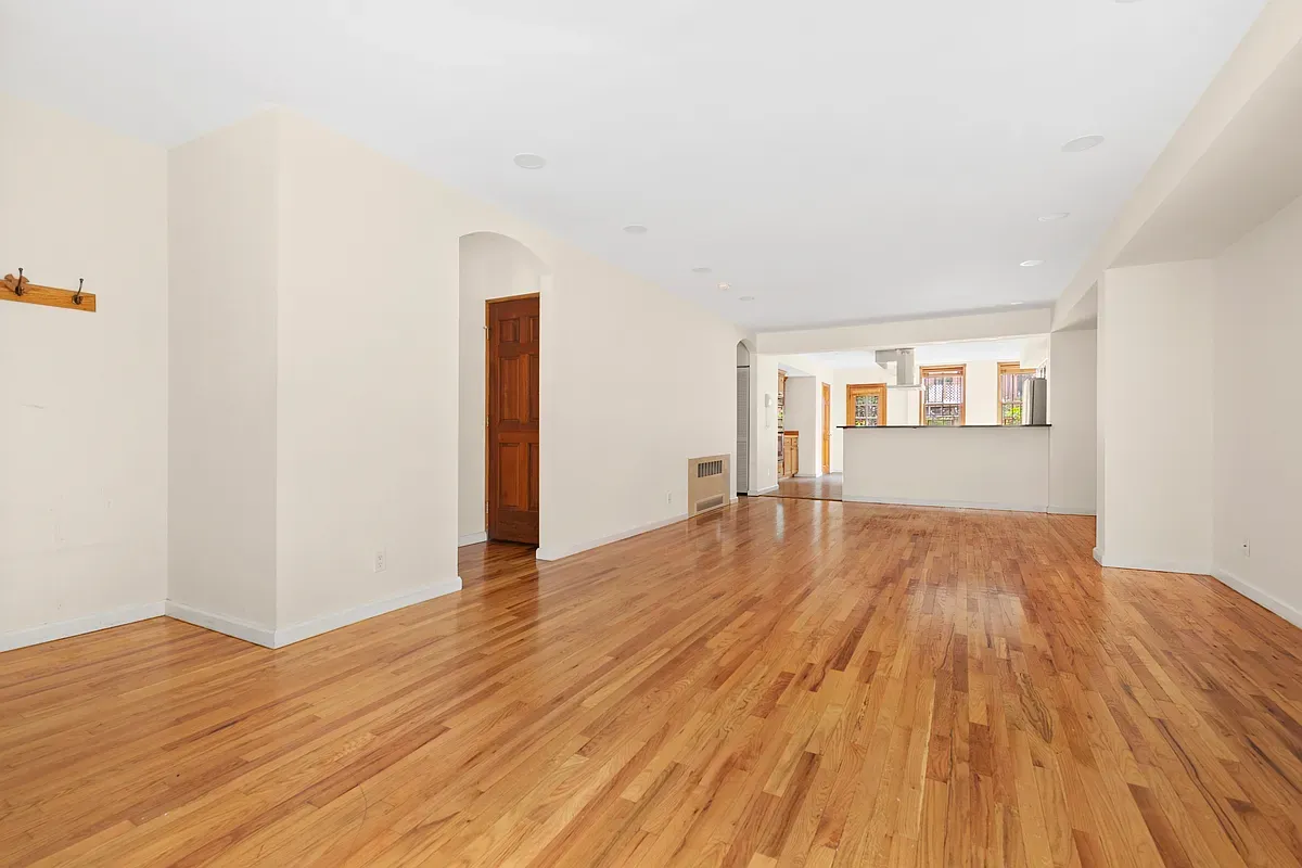 Empty parlor floor with wood floors at 14 West 121st Street