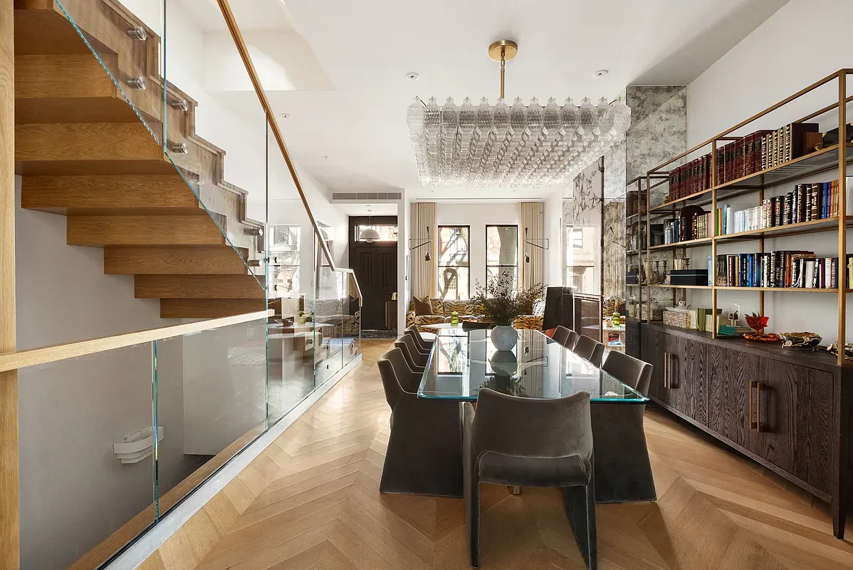 Dining room beside a floating oak staircase at 26 West 95th Street