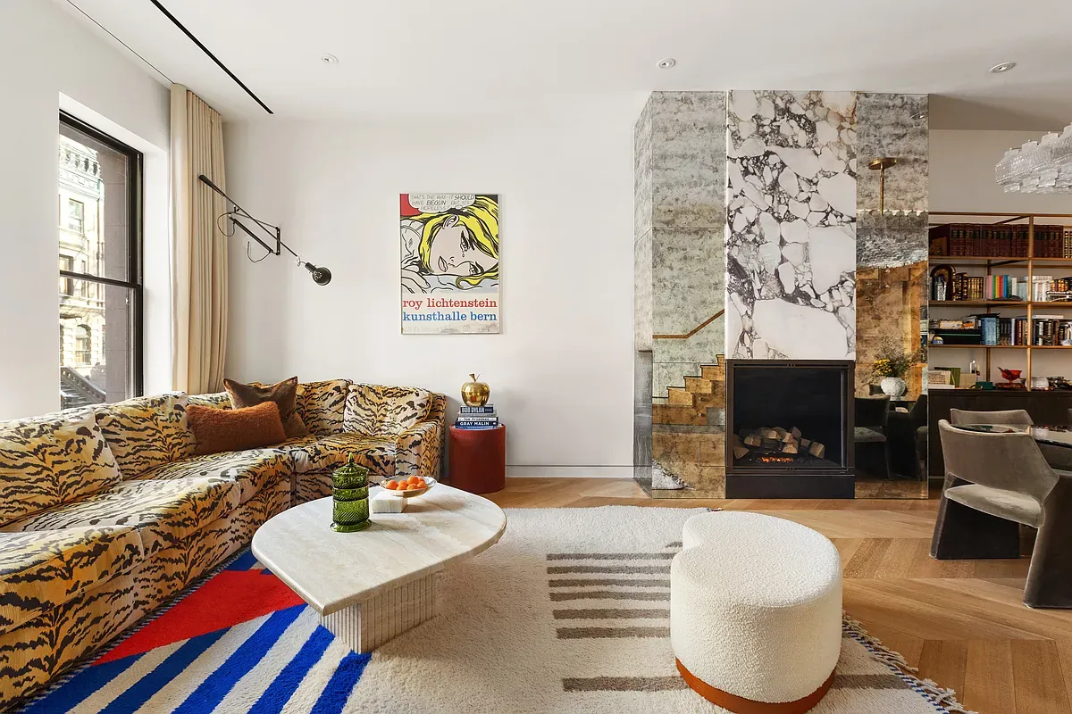 Living room with marble fireplace wall at 26 West 95th Street