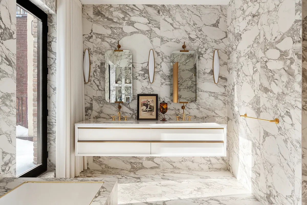 Marble primary bathroom with double vanity at 26 West 95th Street