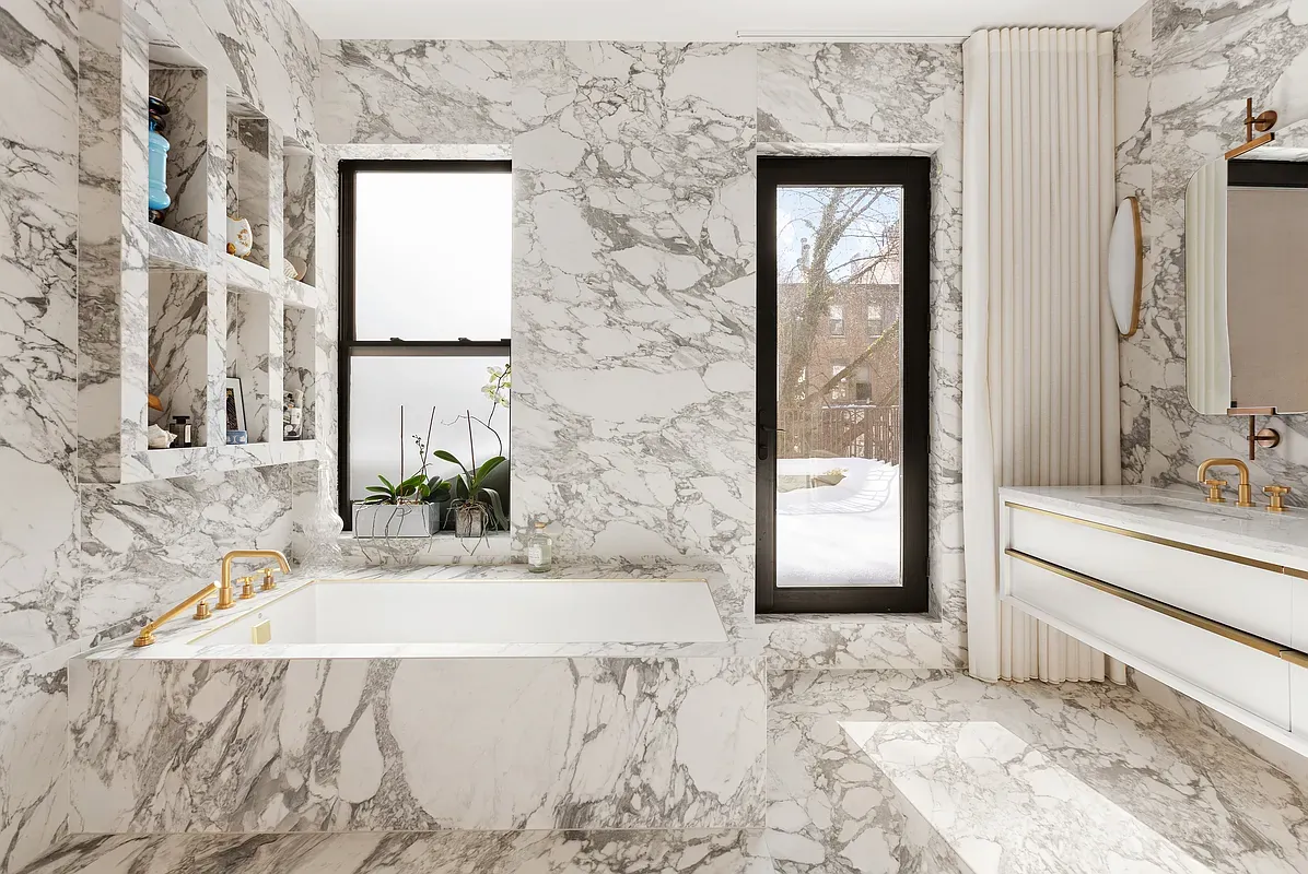 Marble primary bathroom with soaking tub at 26 West 95th Street