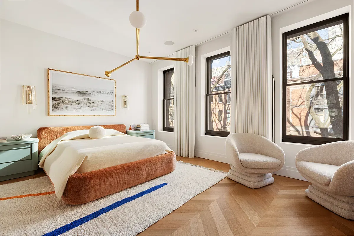 Primary bedroom with oak floors at 26 West 95th Street