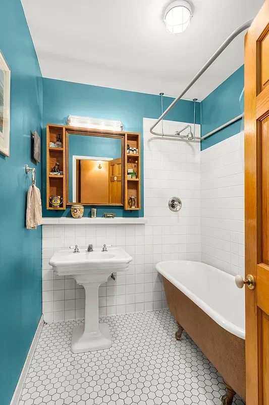 Bathroom with clawfoot tub and pedestal sink at 306 West 90th Street #1
