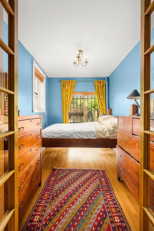 Bedroom with a garden-facing window at 306 West 90th Street #1