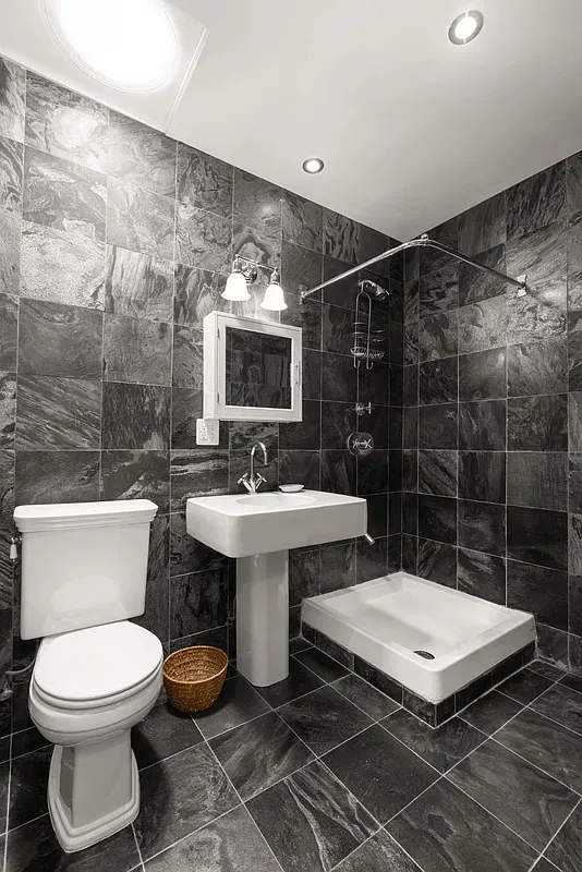 Slate-tiled bathroom at 360 West 121st Street