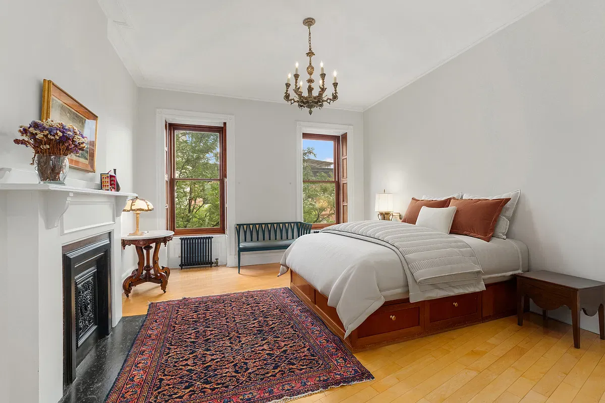Bedroom with marble fireplace at 360 West 121st Street