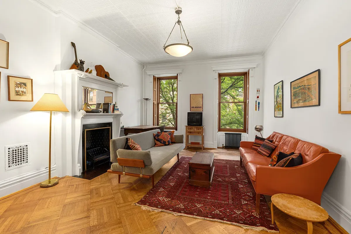Living room with fireplace at 360 West 121st Street