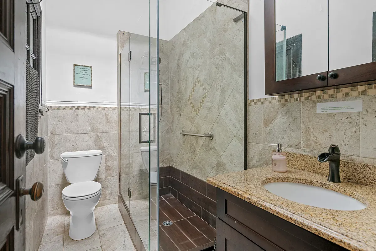 Bathroom with glass shower at 475 West 144th Street