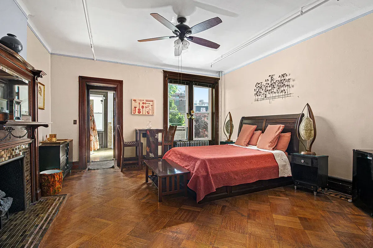 Bedroom with fireplace and parquet floors at 475 West 144th Street