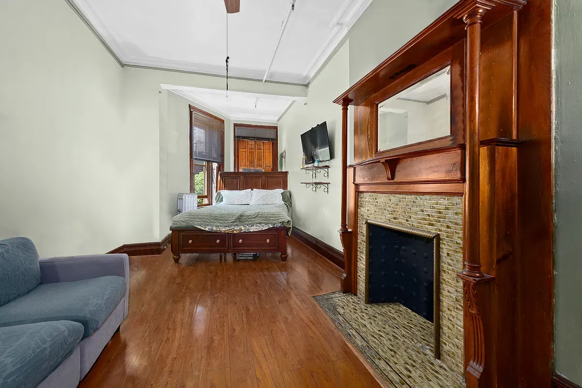 Bedroom with tiled fireplace at 475 West 144th Street