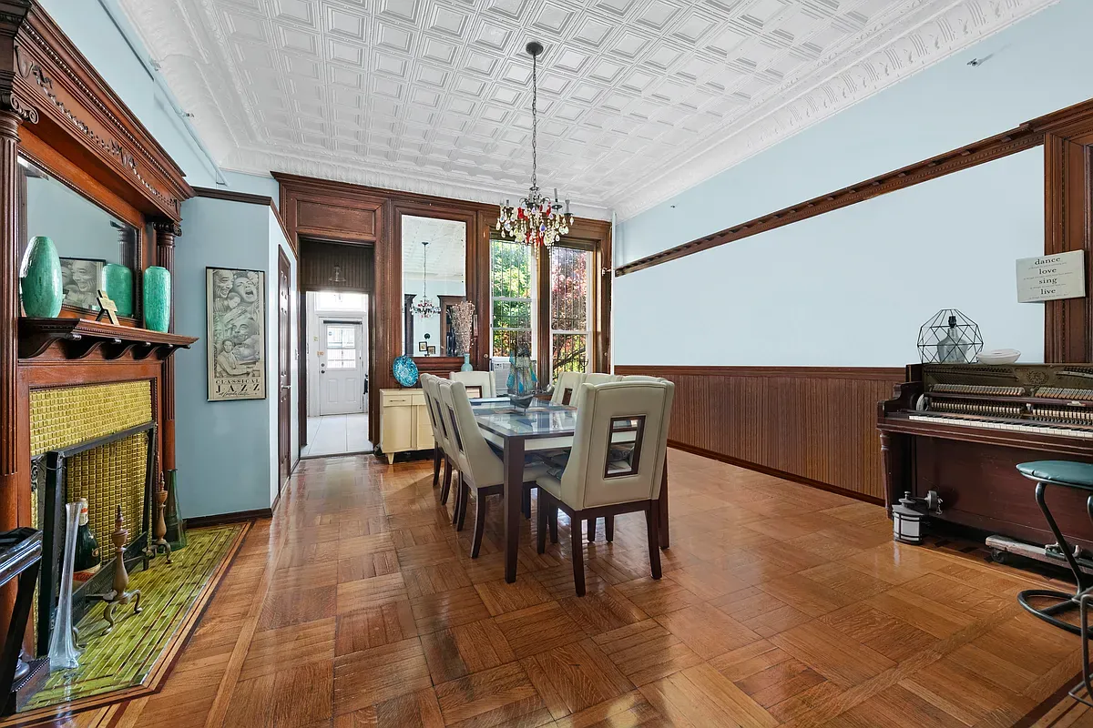 Dining room with tin ceiling and wainscoting at 475 West 144th Street