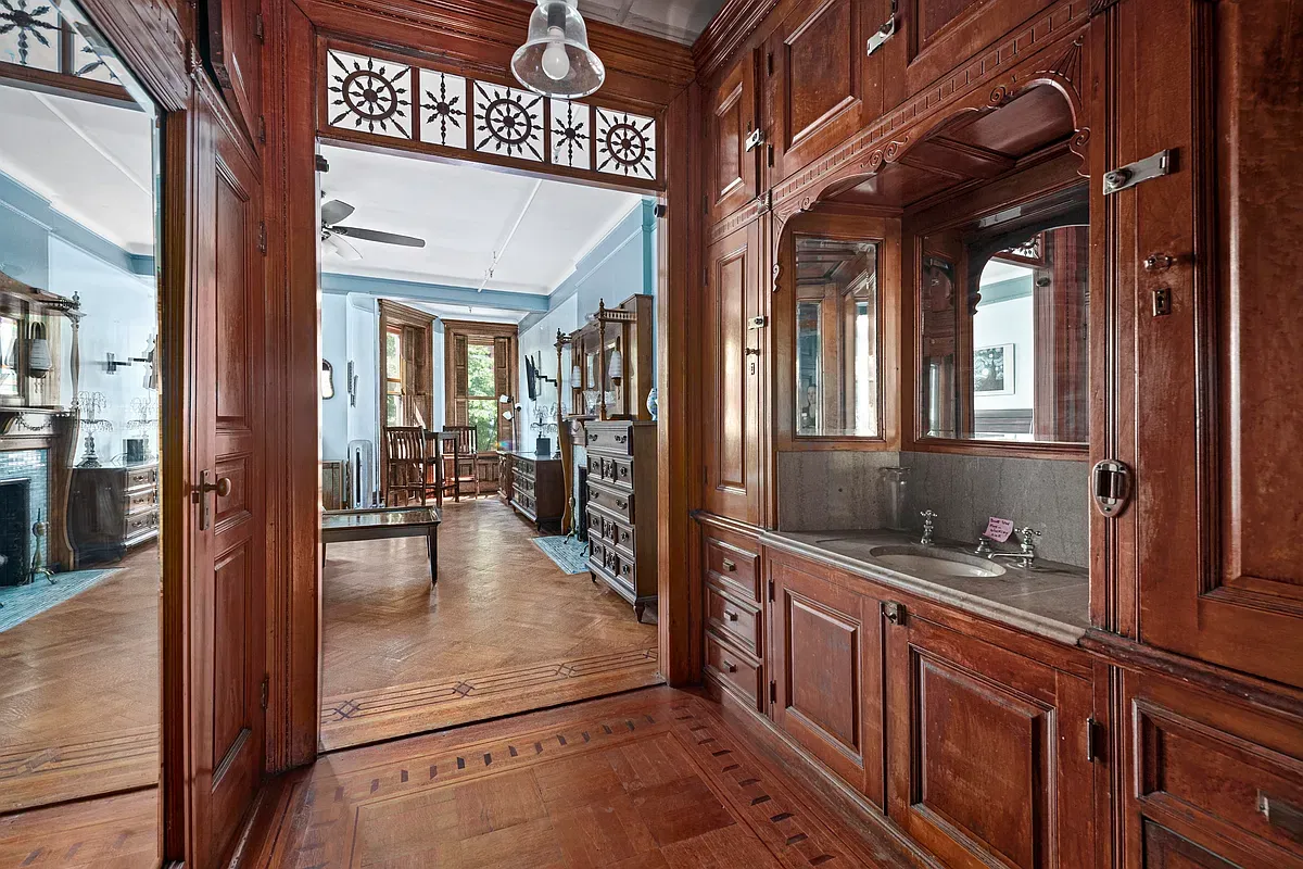 Original carved woodwork and built-in cabinetry at 475 West 144th Street