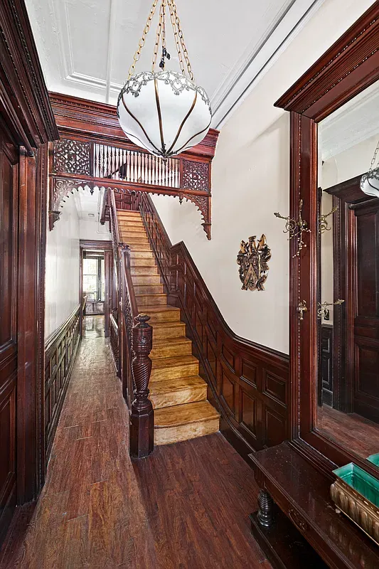 Stair hall with original wood staircase at 475 West 144th Street