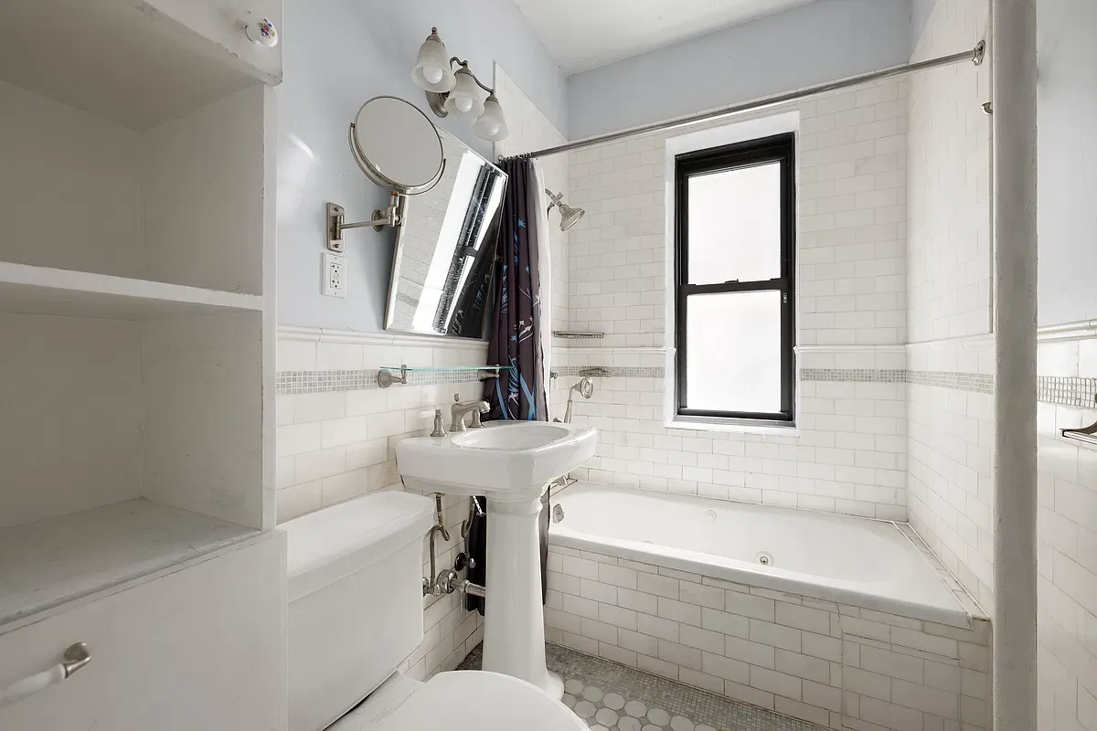 Bathroom with subway tile and tub at 523 West 121st Street #2