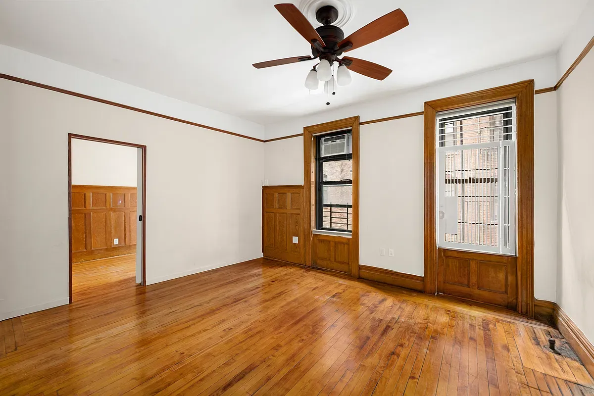 Living room with doorway to the dining room at 523 West 121st Street #2