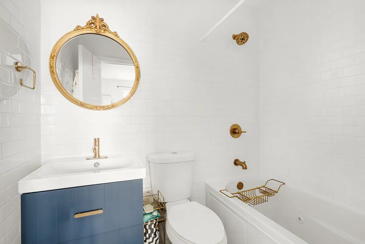 Bathroom with brass fixtures at 642 West 138th Street