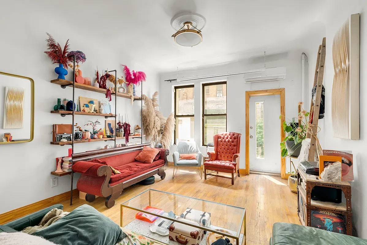 Living room with tall windows at 642 West 138th Street