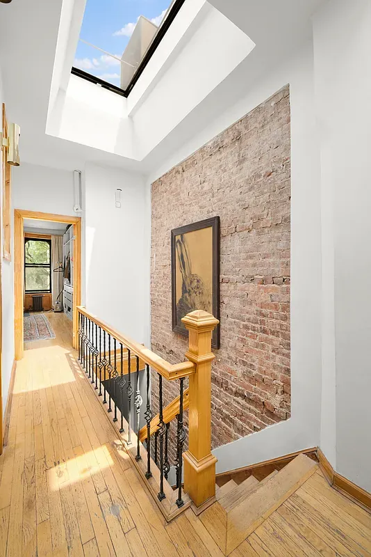 Stair hall under a skylight at 642 West 138th Street