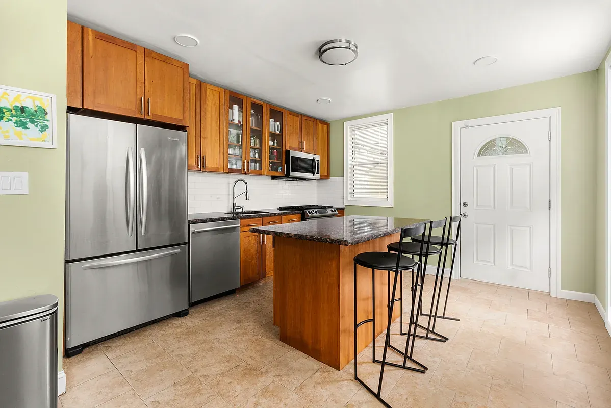 Kitchen with island and stainless appliances at 6655 Sedgwick Place