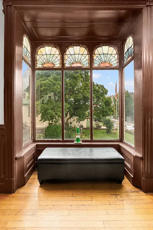 Window seat under stained glass at 6655 Sedgwick Place
