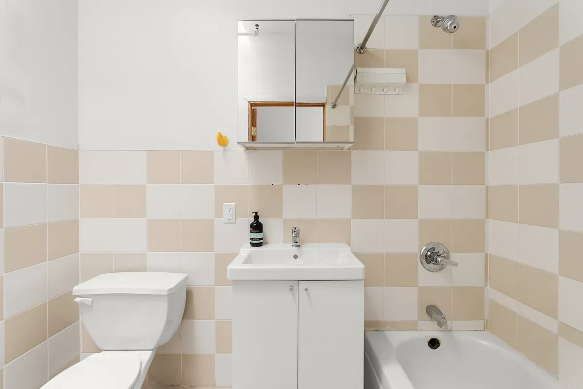 Bathroom with checkered tile at 80 West 119th Street