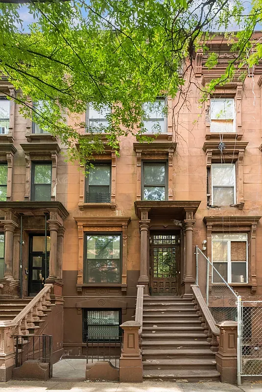 Brownstone facade and stoop at 80 West 119th Street in Harlem