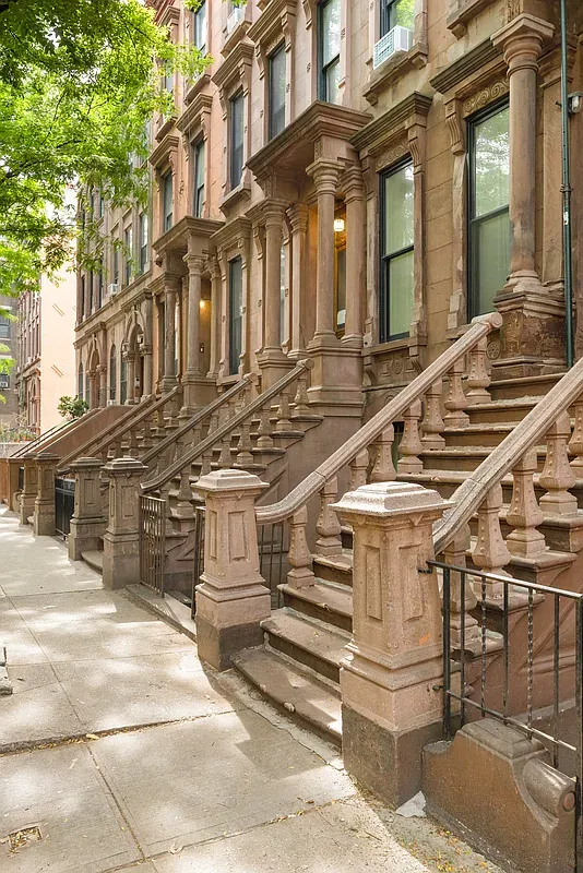 Brownstone stoops on West 119th Street in Harlem