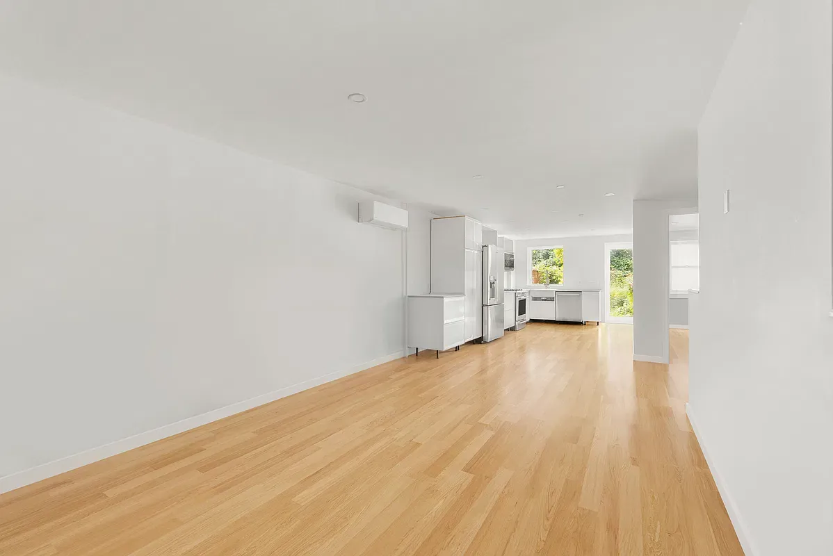 Long open floor with wood floors at 80 West 119th Street