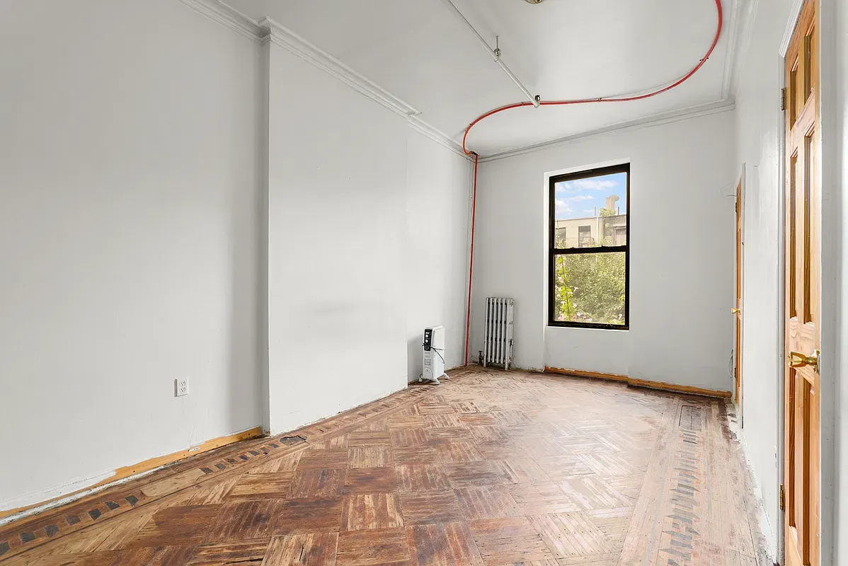 Room with parquet floor at 80 West 119th Street