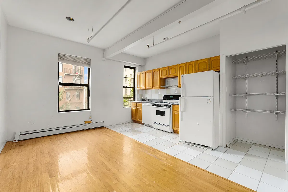 Room with kitchen and closet at 80 West 119th Street