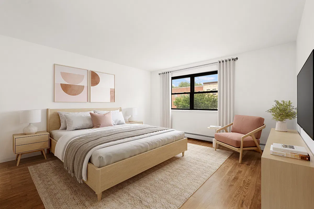 Virtually staged bedroom with wood floors at 904 Gates Avenue