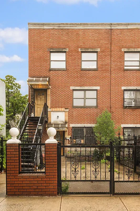 Brick house facade and gated entry at 904 Gates Avenue in Bedford-Stuyvesant, Brooklyn