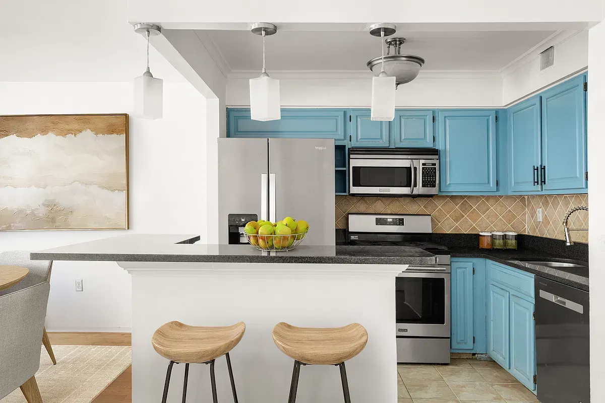 Virtually staged kitchen with breakfast bar at 904 Gates Avenue