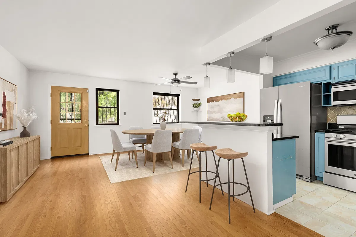 Virtually staged open kitchen, dining and living area at 904 Gates Avenue