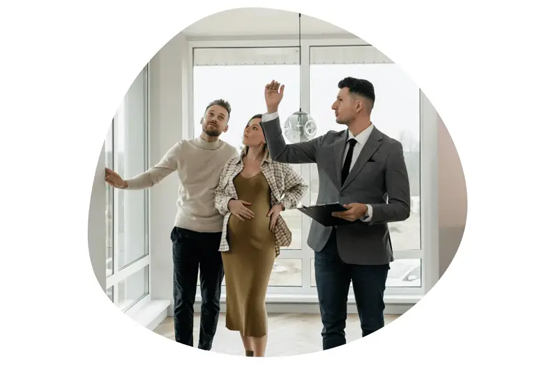 Realtor showing a couple a home